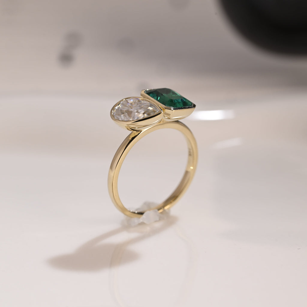 Solid Gold Bezel Toi et Moi Lab Emerald & Pear Cut Moissanite Engagement Ring