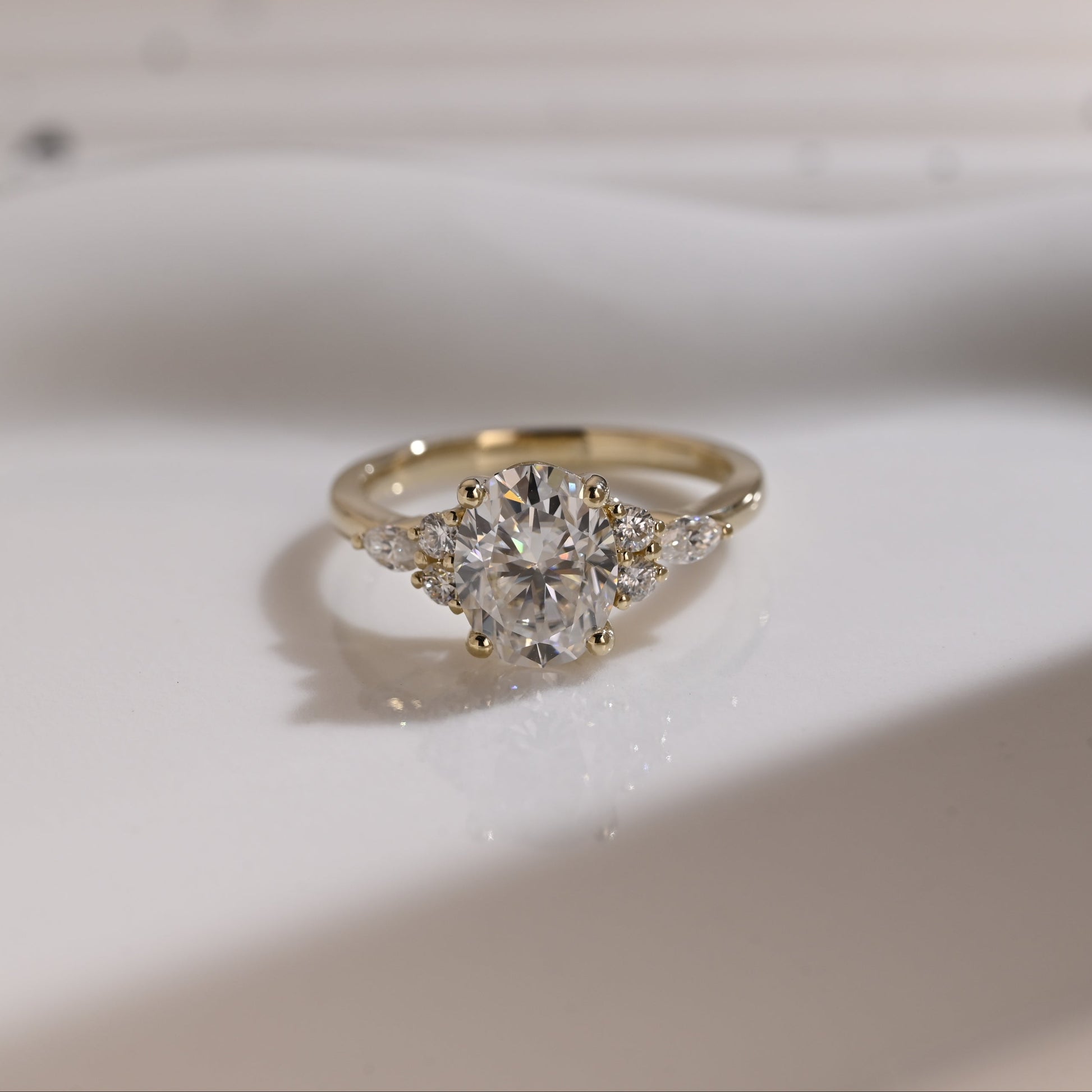 Solid Gold Side Cluster Oval Cut Moissanite Engagement Ring