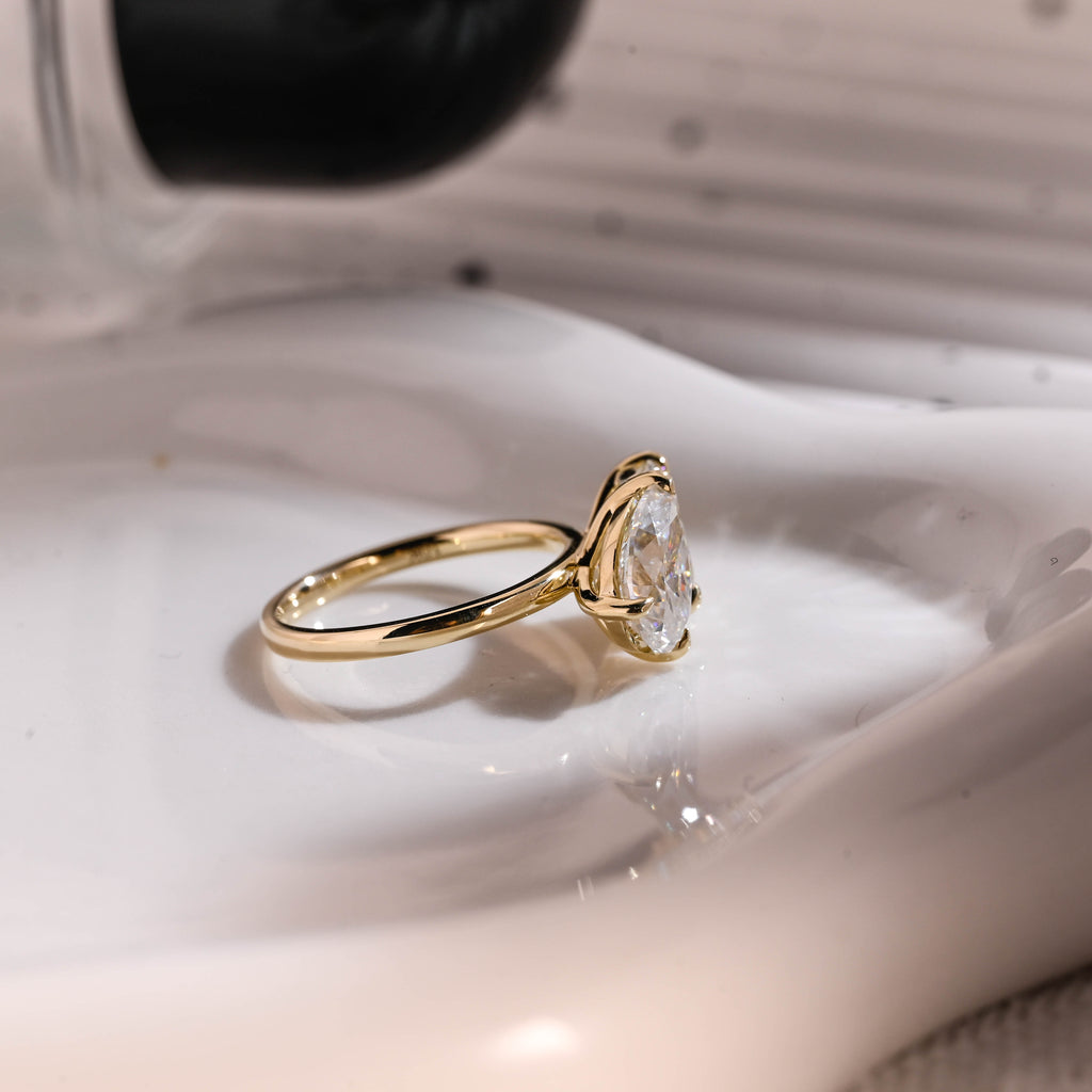 Solid Gold Toi et Moi Emerald Cut & Pear Cut Moissanite Engagement Ring
