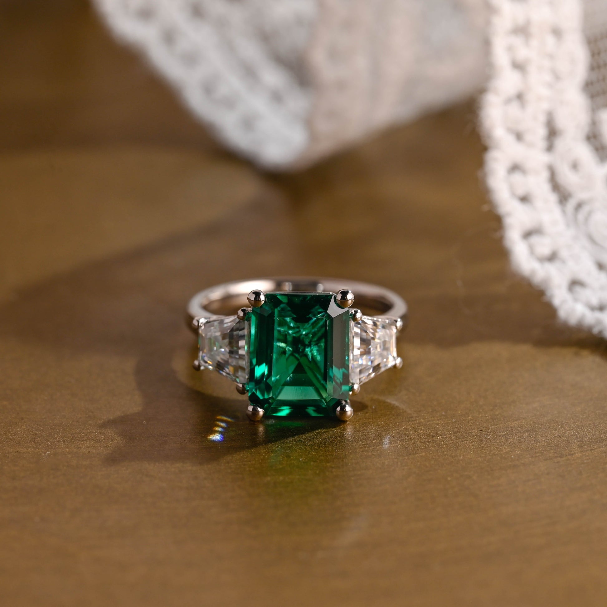 SquareJewelry emerald cut lab grown emerald engagement ring Solid Gold Three Stone Lab Grown Emerald Engagement Ring with Trapezoid Side Stone