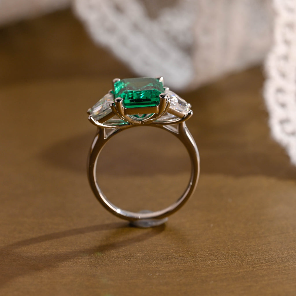 SquareJewelry emerald cut lab grown emerald engagement ring Solid Gold Three Stone Lab Grown Emerald Engagement Ring with Trapezoid Side Stone