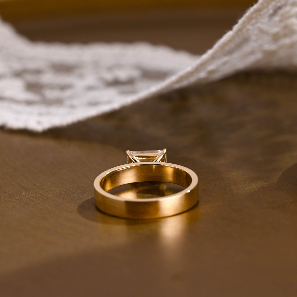 SquareJewelry emerald cut moissanite engagement ring East-West Wide Band Emerald Cut Moissanite Engagement Ring