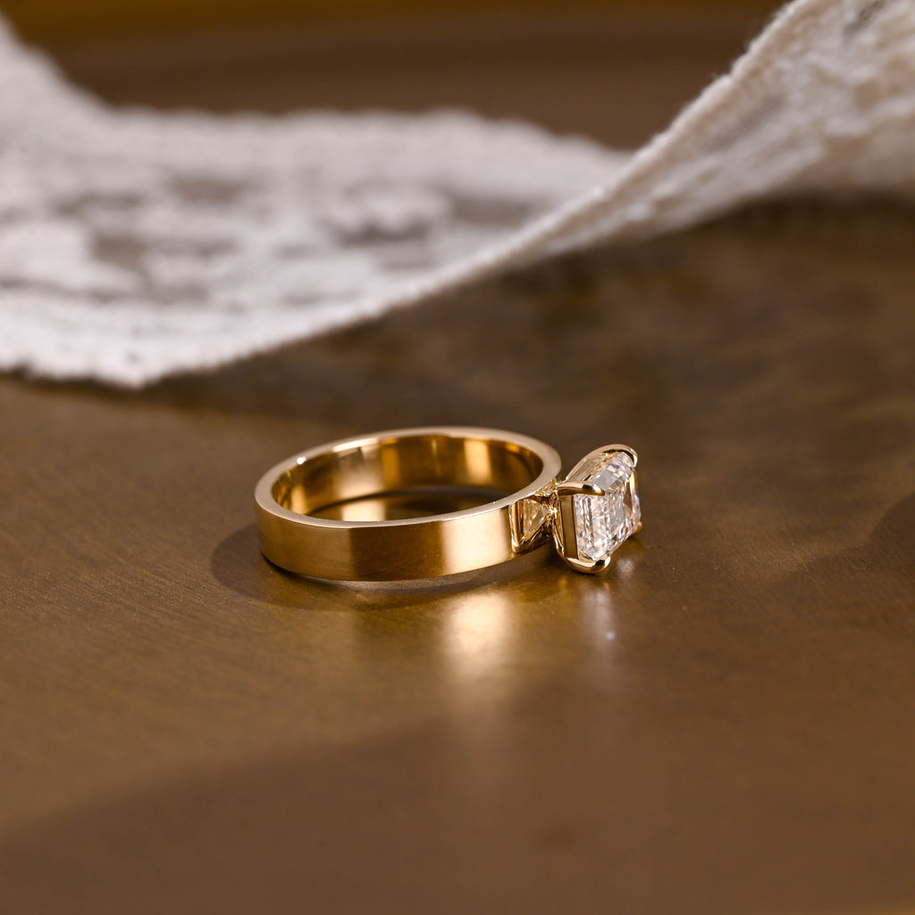 SquareJewelry emerald cut moissanite engagement ring East-West Wide Band Emerald Cut Moissanite Engagement Ring