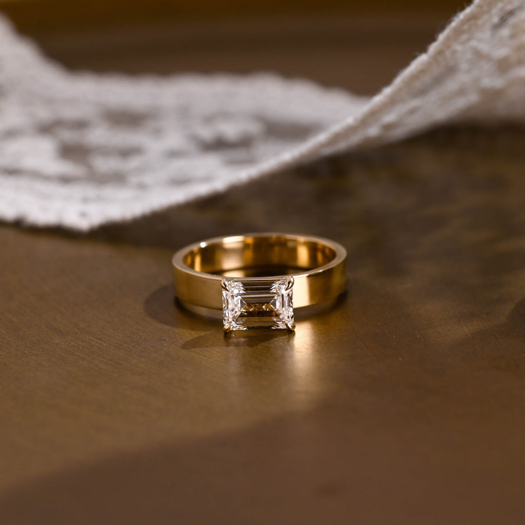 SquareJewelry emerald cut moissanite engagement ring East-West Wide Band Emerald Cut Moissanite Engagement Ring