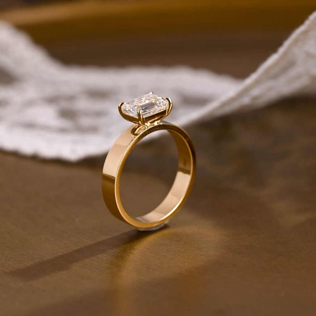 SquareJewelry emerald cut moissanite engagement ring East-West Wide Band Emerald Cut Moissanite Engagement Ring