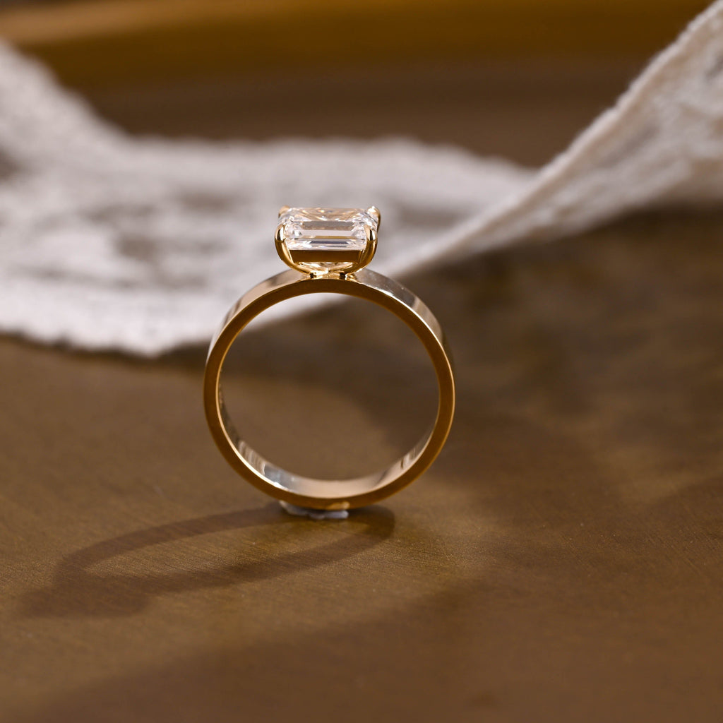 SquareJewelry emerald cut moissanite engagement ring East-West Wide Band Emerald Cut Moissanite Engagement Ring