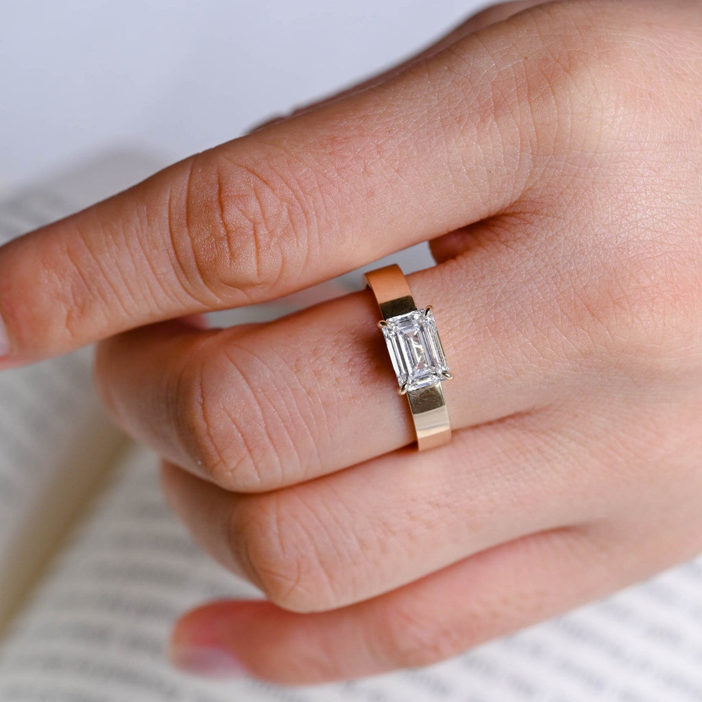 SquareJewelry emerald cut moissanite engagement ring East-West Wide Band Emerald Cut Moissanite Engagement Ring