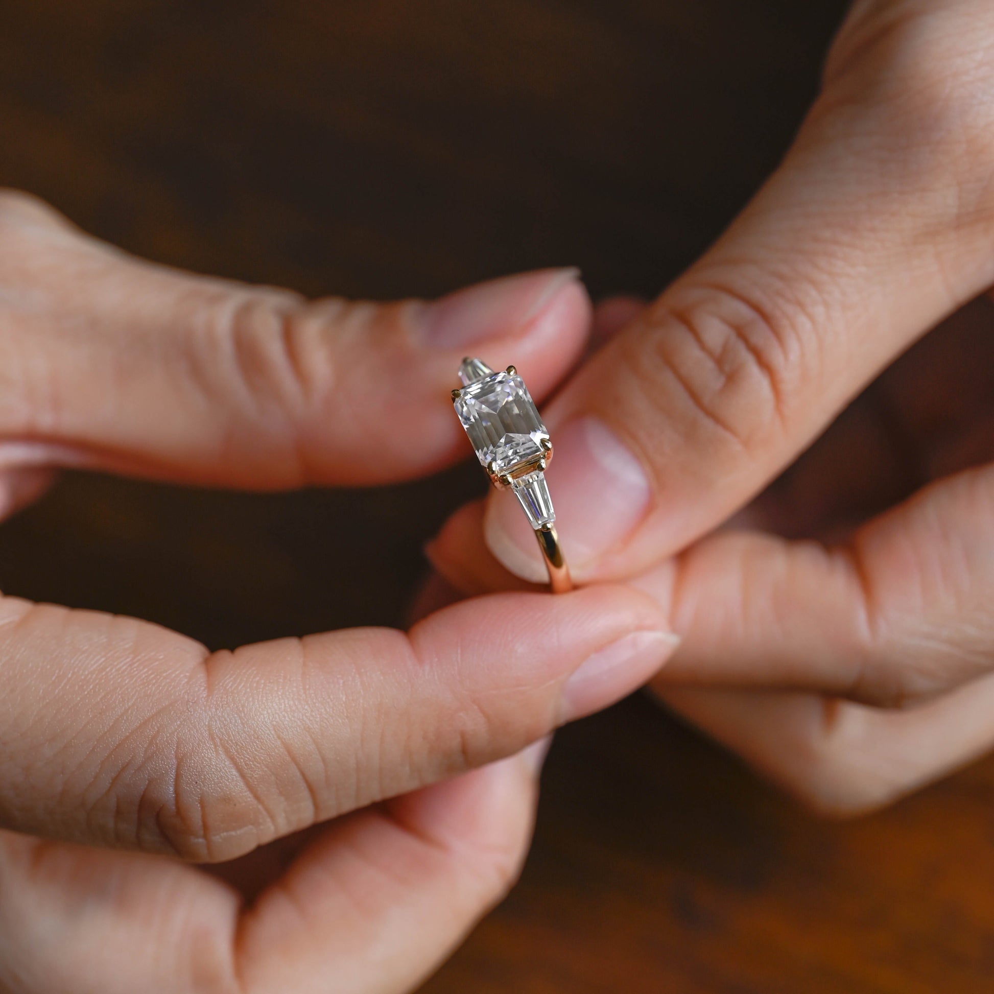 SquareJewelry emerald cut moissanite engagement ring Solid Gold East-West Tapered Baguette Three Stone Emerald Cut Moissanite Engagement Ring