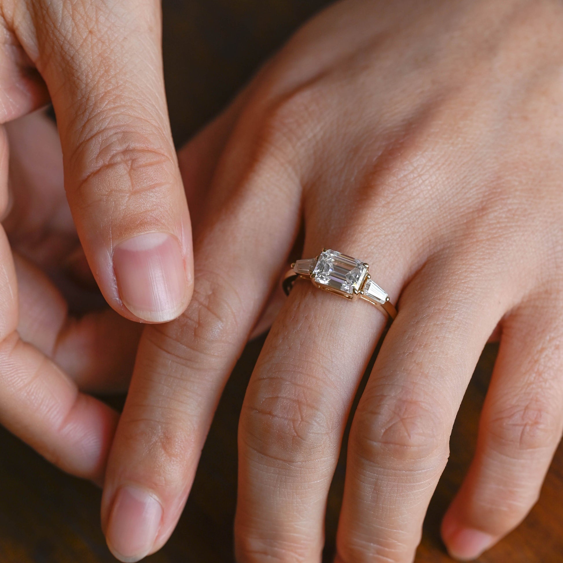 SquareJewelry emerald cut moissanite engagement ring Solid Gold East-West Tapered Baguette Three Stone Emerald Cut Moissanite Engagement Ring