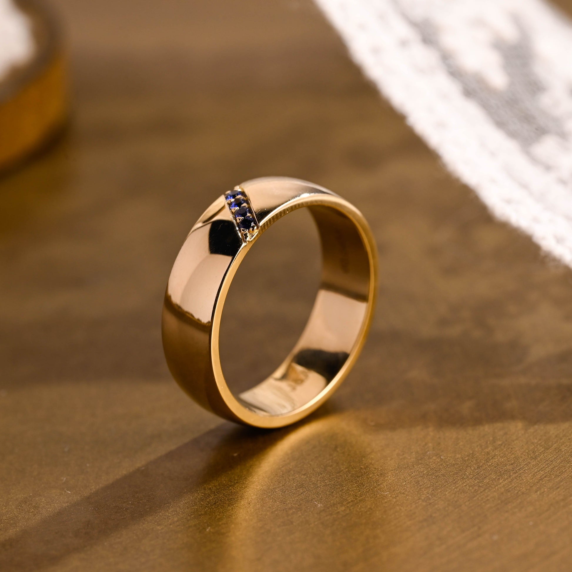 SquareJewelry men's wedding ring Solid Gold Lab Grown Blue Sapphire Accents 6mm Unisex Wedding Band